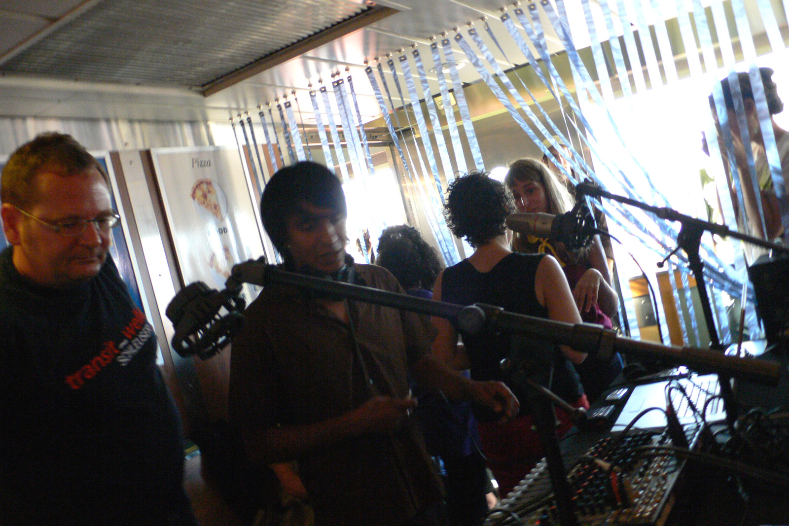 The FM Ferry Experiment studio on the Guy Molinari Staten Island Ferry. Image features (left to right) on-air guest -Ralf Homann, Angel Nevarez of neuroTransmitter, Valerie Tevere of neuroTransmitter, and Hanna Rose Shell, invited artist.